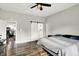 Bedroom featuring hardwood floors, a large closet, a ceiling fan, and plenty of space at 424 N Randolph St, Indianapolis, IN 46201