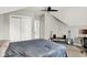 Bedroom featuring sloped ceilings, a bed, a desk, and multiple guitars at 424 N Randolph St, Indianapolis, IN 46201