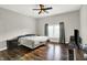 Bedroom with a ceiling fan, hardwood floors, and a large window at 424 N Randolph St, Indianapolis, IN 46201