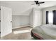 Bright bedroom with neutral walls, plush carpeting, and a double door closet for storage at 424 N Randolph St, Indianapolis, IN 46201
