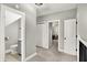 Upstairs hallway featuring carpet, a bathroom, and doorways to other rooms at 424 N Randolph St, Indianapolis, IN 46201