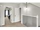 Upstairs hallway with doorways into the rooms and a view of the stairs at 424 N Randolph St, Indianapolis, IN 46201