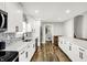 Bright kitchen with stainless steel appliances, white cabinets, and stylish backsplash at 424 N Randolph St, Indianapolis, IN 46201
