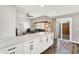 Open-concept layout with kitchen island, wood flooring and sliding glass doors to the backyard at 424 N Randolph St, Indianapolis, IN 46201