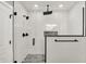 Stylish walk-in shower featuring white subway tile and matte black hardware at 424 N Randolph St, Indianapolis, IN 46201