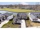 Stunning aerial view of luxury home overlooking golf course and pond at 4258 Hamilton Run, Zionsville, IN 46077