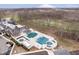 Aerial view featuring a swimming pool with nearby golf course at 4258 Hamilton Run, Zionsville, IN 46077