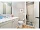 Stylish half bathroom with modern sink, white mosaic tile wall, and decorative lighting at 4258 Hamilton Run, Zionsville, IN 46077