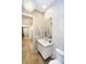 Well-lit powder room featuring mosaic tile, a crystal chandelier, and hardwood floors at 4258 Hamilton Run, Zionsville, IN 46077