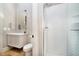 Elegant bathroom with walk-in shower, white herringbone tile, and modern fixtures at 4258 Hamilton Run, Zionsville, IN 46077