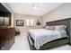 Serene bedroom with a comfortable bed, ceiling fan, and stylish decor at 4258 Hamilton Run, Zionsville, IN 46077