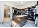 Spacious walk-in closet with custom shelving, center island and hardwood floors at 4258 Hamilton Run, Zionsville, IN 46077