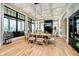 Bright dining room featuring modern light fixture, hardwood flooring, and large windows at 4258 Hamilton Run, Zionsville, IN 46077