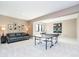 Spacious game room with a ping pong table, comfortable seating, and decorative wall art at 4258 Hamilton Run, Zionsville, IN 46077