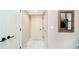 Neutral hallway featuring doors, white trim, and modern decor at 4258 Hamilton Run, Zionsville, IN 46077