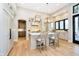 Kitchen with bright countertops, oversized island, stainless appliances, and hardwood flooring at 4258 Hamilton Run, Zionsville, IN 46077