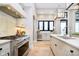 Gourmet kitchen with large island, stainless steel appliances, and custom cabinetry at 4258 Hamilton Run, Zionsville, IN 46077