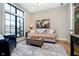 Bright living room with large window, modern decor, and a comfortable seating area at 4258 Hamilton Run, Zionsville, IN 46077
