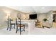 Entertain in style with this living room, featuring bar seating, large TV, and cozy furniture at 4258 Hamilton Run, Zionsville, IN 46077