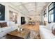 Open concept living room with coffered ceilings flows to bright dining and kitchen at 4258 Hamilton Run, Zionsville, IN 46077