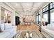 Spacious living room open to the dining area, featuring hardwood floors and coffered ceilings at 4258 Hamilton Run, Zionsville, IN 46077
