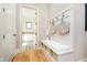 Mudroom with bench seating, storage cubbies, and access to laundry room beyond at 4258 Hamilton Run, Zionsville, IN 46077