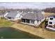Back exterior of residence with a screened-in porch, overlooking the pond at 4258 Hamilton Run, Zionsville, IN 46077