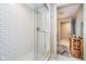 Modern bathroom featuring a glass-enclosed shower with white subway tiles and a patterned floor at 4258 Hamilton Run, Zionsville, IN 46077