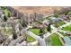 An aerial view of a well-maintained home nestled amongst mature trees and lush green lawns at 4263 W Fox Ridge Ave, Greenwood, IN 46143