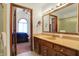 Bright bathroom featuring a vanity with framed mirror, and bedroom view, providing a comfortable, updated space at 4263 W Fox Ridge Ave, Greenwood, IN 46143