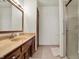 Neutral bathroom featuring a vanity with framed mirror, and a shower, for a practical, comfortable space at 4263 W Fox Ridge Ave, Greenwood, IN 46143
