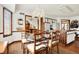 The dining room features a crystal chandelier, a glass table, and wooden chairs at 4263 W Fox Ridge Ave, Greenwood, IN 46143
