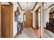 Elegant foyer with wood floors, a striking chandelier, and a decorative mirror, creating a grand entrance at 4263 W Fox Ridge Ave, Greenwood, IN 46143