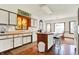 The kitchen features an island with seating, hard wood floors, and lots of cabinet space at 4263 W Fox Ridge Ave, Greenwood, IN 46143