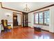 Living room with hardwood floors, detailed trim, and large picture window at 4263 W Fox Ridge Ave, Greenwood, IN 46143