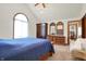 The main bedroom features vaulted ceilings, hardwood furniture, and neutral carpet at 4263 W Fox Ridge Ave, Greenwood, IN 46143