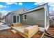Charming home featuring a wood deck and a sliding glass door leading to the gray-colored exterior at 4721 Ralston Ave, Indianapolis, IN 46205