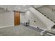 Finished basement featuring a barn door, stairs, laundry sink, utility hookups, and neutral carpeting at 4721 Ralston Ave, Indianapolis, IN 46205