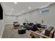 Cozy basement living area features neutral paint, carpeted flooring, recessed lighting, and modern furniture at 4721 Ralston Ave, Indianapolis, IN 46205