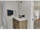 Bathroom with wood vanity, granite countertops, black fixtures, and bathtub at 4721 Ralston Ave, Indianapolis, IN 46205