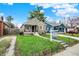 Quaint house with beautiful landscaping and a long driveway at 4721 Ralston Ave, Indianapolis, IN 46205