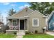 Charming home with a cozy front porch featuring a seating area at 4721 Ralston Ave, Indianapolis, IN 46205