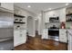 Beautiful renovated kitchen with stainless steel appliances, granite countertops, and hardwood floors at 4721 Ralston Ave, Indianapolis, IN 46205