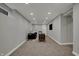 Spacious living area boasts neutral tones, recessed lights, a tv, and comfortable seating at 4721 Ralston Ave, Indianapolis, IN 46205