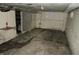 Basement featuring white walls, concrete floor, and an open doorway at 4925 E New York St, Indianapolis, IN 46201