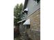 The exterior features brick and siding and could use some repairs at 4925 E New York St, Indianapolis, IN 46201