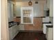 Kitchen featuring vintage white cabinets and a window at 4925 E New York St, Indianapolis, IN 46201