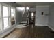 Living room showcasing a staircase and hardwood floors at 4925 E New York St, Indianapolis, IN 46201