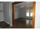 Room with hardwood floors viewed through a doorway at 4925 E New York St, Indianapolis, IN 46201
