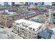 An aerial view showcases the modern architecture and urban setting of the property at 504 N Park Ave # 3, Indianapolis, IN 46202